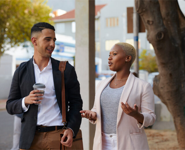 Man and women walking and talking